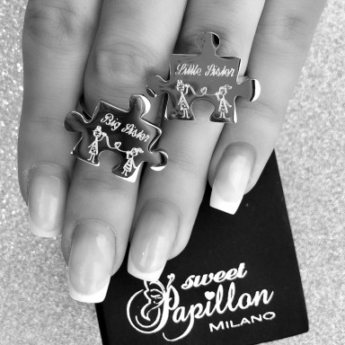 Pair of stainless steel puzzle sister rings