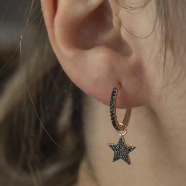 Single star earring in 925 rhodium silver with zircons