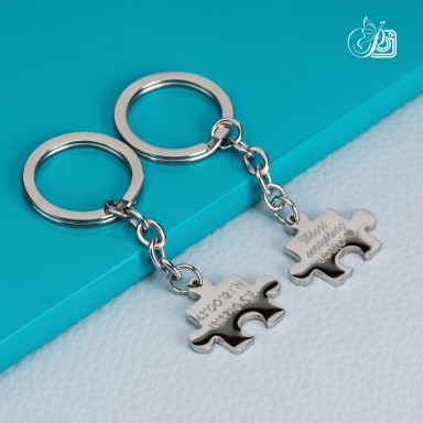 Pair of stainless steel puzzle keychains