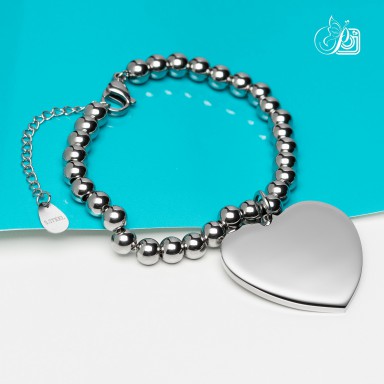 Bracciale con palline e cuore pendente in acciaio inox